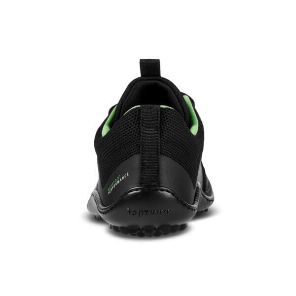 A back view of the shoe with green accents.