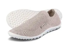 Beige knitted slip-on shoes with white soles.