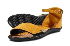 Yellow suede sandals with black buckle and sole.