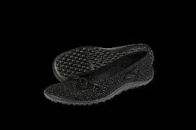 Black knit slip-on shoes with textured soles.